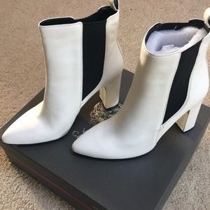 Winter white boots black stripes Vince Camuto.